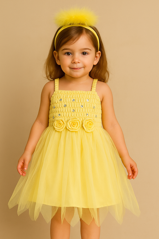 Young girl wearing a yellow fairy dress with floral details on a beige background