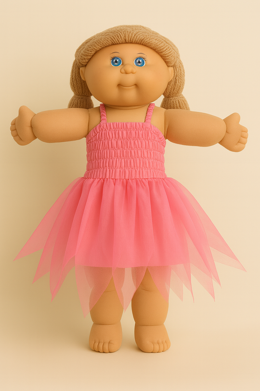 Cabbage Patch doll wearing a pink dress on a beige background