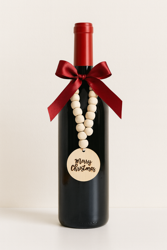 Wine bottle with 'Best Teacher Ever' tag in a woven basket with notebook and pen