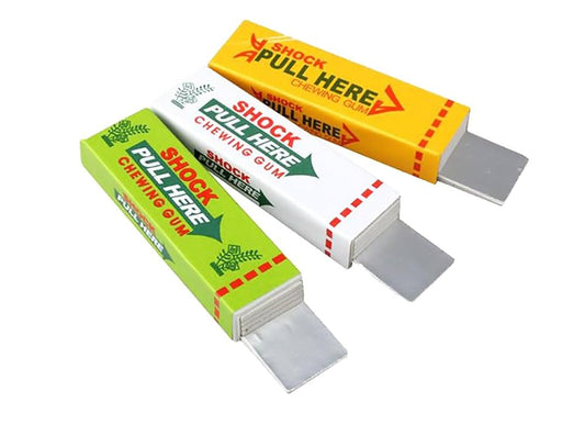 Three packages of 'Shock Pull Here' chewing gum on a white background