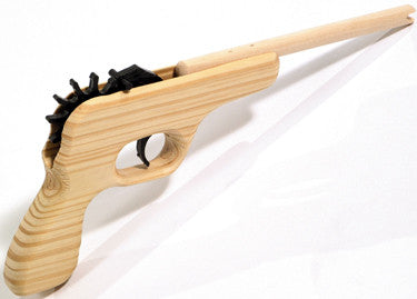 Wooden tool with a handle and black bristle end on a white background