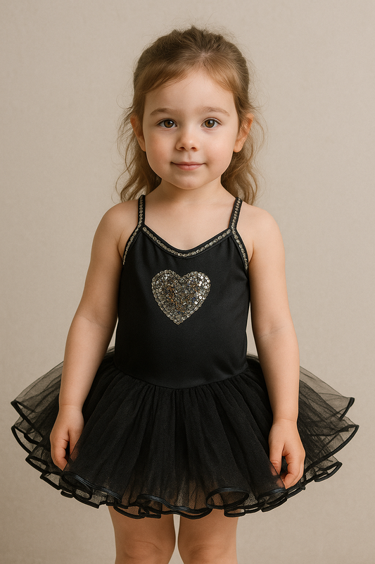 Black pink tutu with a silver heart on a mannequin against a beige background